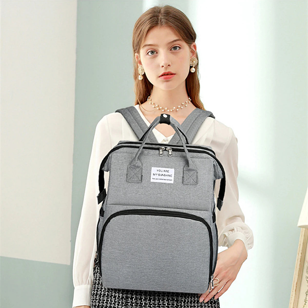 Portable Diaper Bag with Foldable Baby Bed